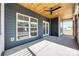 Covered porch with ceiling fan, screened section, and view of rural landscape at 636 Edwards Rd, Fort Lawn, SC 29714
