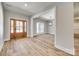 Light-filled entryway with hardwood floors and view to dining area at 636 Edwards Rd, Fort Lawn, SC 29714