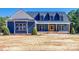 Craftsman style home with blue siding, white accents, and a large front porch at 636 Edwards Rd, Fort Lawn, SC 29714
