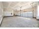 Unfinished garage with concrete floor and automatic garage door at 636 Edwards Rd, Fort Lawn, SC 29714