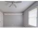 Unfurnished bedroom with a ceiling fan and window with natural light at 8468 Blades Trl, Denver, NC 28037