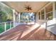 Screened porch featuring brick flooring, views of the backyard, and a ceiling fan at 8468 Blades Trl, Denver, NC 28037