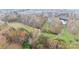 Aerial view of property showing expansive acreage, pond, and wooded area at 100 Steffey Ln, Taylorsville, NC 28681