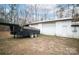 Large detached garage with double doors and extra storage space at 100 Steffey Ln, Taylorsville, NC 28681