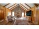 Cozy living room featuring a stone fireplace and vaulted wood ceilings at 100 Steffey Ln, Taylorsville, NC 28681