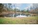 Serene pond with gazebo and autumn leaves around at 100 Steffey Ln, Taylorsville, NC 28681
