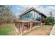 Large sunroom addition with glass walls and stone base at 100 Steffey Ln, Taylorsville, NC 28681