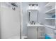 Updated bathroom with gray vanity, walk-in shower, and shelving at 1485 Nc Hwy 16 N Hwy, Taylorsville, NC 28681
