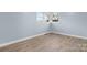 Spacious bedroom with wood-look floors and corner windows at 1485 Nc Hwy 16 N Hwy, Taylorsville, NC 28681