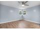 Light and airy bedroom featuring wood-look floors and large windows at 1485 Nc Hwy 16 N Hwy, Taylorsville, NC 28681