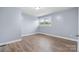 Simple bedroom with wood-look floors and a window at 1485 Nc Hwy 16 N Hwy, Taylorsville, NC 28681