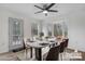 Virtually staged dining area with table, chairs, and large windows at 1485 Nc Hwy 16 N Hwy, Taylorsville, NC 28681