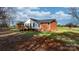Brick home with a large deck and partial white siding at 1485 Nc Hwy 16 N Hwy, Taylorsville, NC 28681