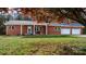 Brick ranch home with covered porch and landscaped yard at 1485 Nc Hwy 16 N Hwy, Taylorsville, NC 28681