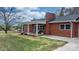 Brick home with a covered porch and well-maintained lawn at 1485 Nc Hwy 16 N Hwy, Taylorsville, NC 28681