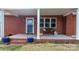 Covered porch with brick steps and blue flower pots at 1485 Nc Hwy 16 N Hwy, Taylorsville, NC 28681