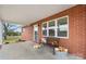 Inviting front porch with brick columns and a charming bench at 1485 Nc Hwy 16 N Hwy, Taylorsville, NC 28681