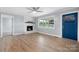 Living room with hardwood floors, fireplace, and a view to the kitchen at 1485 Nc Hwy 16 N Hwy, Taylorsville, NC 28681