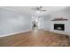 Bright living room featuring hardwood floors, fireplace, and an open floor plan at 1485 Nc Hwy 16 N Hwy, Taylorsville, NC 28681