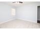 Bright bedroom featuring a ceiling fan, white walls, and ceramic tile floors at 1106 Chandler Dr, Rock Hill, SC 29732