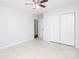A bright bedroom with white walls, ceramic tile floors, and a spacious closet at 1106 Chandler Dr, Rock Hill, SC 29732