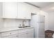 Well-lit kitchen features stainless steel sink, and white cabinets and countertops at 1106 Chandler Dr, Rock Hill, SC 29732