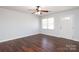 Spacious living room with hardwood-style floors, ceiling fan, and a large window at 1106 Chandler Dr, Rock Hill, SC 29732