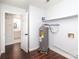 Well-lit utility room with dark flooring and an adjacent bathroom at 1106 Chandler Dr, Rock Hill, SC 29732