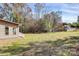Spacious backyard with a well-maintained lawn, ideal for recreation and enjoying the natural surroundings at 12300 Caldwell Rd, Charlotte, NC 28213