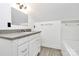 Bathroom with granite countertop, vanity, and decorative backsplash at 12300 Caldwell Rd, Charlotte, NC 28213
