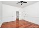 Roomy bedroom with hardwood floors and white trim at 12300 Caldwell Rd, Charlotte, NC 28213