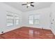 Roomy bedroom with two windows and hardwood flooring at 12300 Caldwell Rd, Charlotte, NC 28213