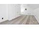 Bonus room with neutral walls, plush carpet, and vaulted ceiling at 12300 Caldwell Rd, Charlotte, NC 28213