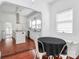 Bright dining area features wood floors, a white walls, and a table covered with a black tablecloth at 12300 Caldwell Rd, Charlotte, NC 28213