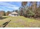 Charming single-story home with a screened porch and beautiful natural surroundings on a sprawling lawn at 12300 Caldwell Rd, Charlotte, NC 28213