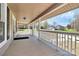 Spacious front porch offers a welcoming entryway to the home, showcasing the covered design at 12300 Caldwell Rd, Charlotte, NC 28213