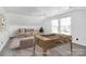 Cozy bonus room with neutral walls, plush carpet, and a fun foosball table at 12300 Caldwell Rd, Charlotte, NC 28213