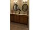 Double vanity bathroom with large mirrors and neutral tones at 1835 Fairlawn Ct, Rock Hill, SC 29732