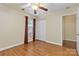 Well-lit bedroom with hardwood floors and double door closet at 1835 Fairlawn Ct, Rock Hill, SC 29732