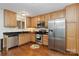 Kitchen boasts stainless steel appliances and wood cabinets at 1835 Fairlawn Ct, Rock Hill, SC 29732