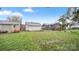 View of backyard featuring grass, neighboring homes, and an outbuilding at 408 E Washington Ave, Bessemer City, NC 28016