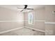 Neutral bedroom with a ceiling fan and ample natural light at 408 E Washington Ave, Bessemer City, NC 28016