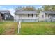 A cozy home with a inviting front porch and classic architectural details at 408 E Washington Ave, Bessemer City, NC 28016