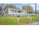 Charming home featuring a quaint front porch and well-maintained lawn at 408 E Washington Ave, Bessemer City, NC 28016