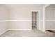 An interior view of a spacious living room with carpeted floors at 408 E Washington Ave, Bessemer City, NC 28016