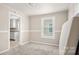 Open living area with a view into the kitchen, showcasing a comfortable space at 408 E Washington Ave, Bessemer City, NC 28016