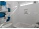 Modern bathroom features a built-in shower niche, white tiling, and window for natural light at 4271 Candlewood Dr, Sherrills Ford, NC 28673