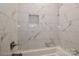 Beautiful bathroom featuring pristine white tile walls and bathtub creating a spa-like experience at 4271 Candlewood Dr, Sherrills Ford, NC 28673