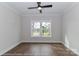 Bedroom featuring dark hardwood floors, neutral colored walls, trim, and a ceiling fan at 4271 Candlewood Dr, Sherrills Ford, NC 28673