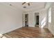 Bright bedroom with hardwood floors, tray ceiling, and white trim at 4271 Candlewood Dr, Sherrills Ford, NC 28673